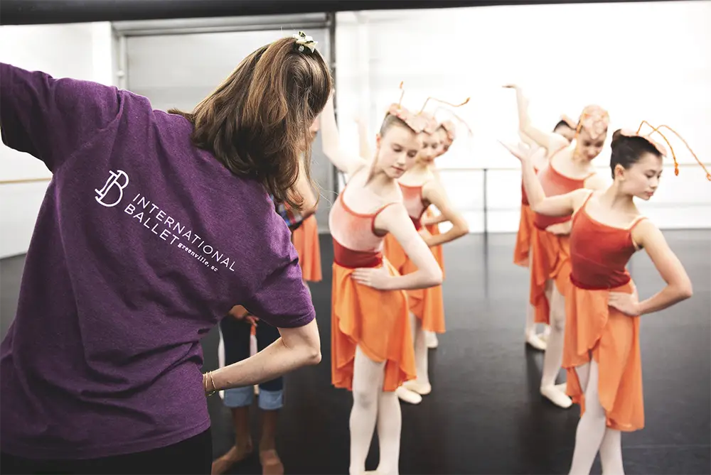 Instructor leading performers while rehearsing for Aunts n' Uncles ballet adaptation